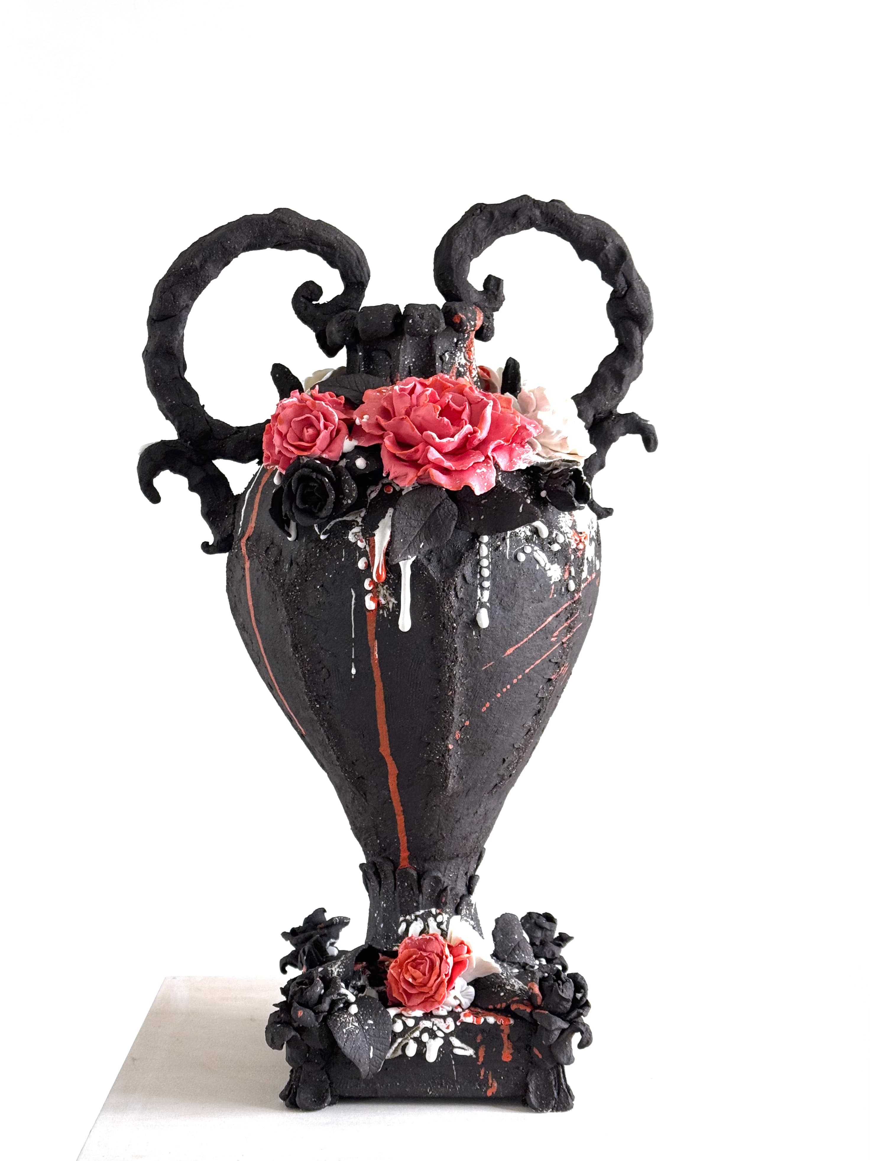 Trophy for the Wild and Wonderful, a black stoneware urn with curling handles and red and white ceramic roses — Trophy Series, Vulcanic Rococo