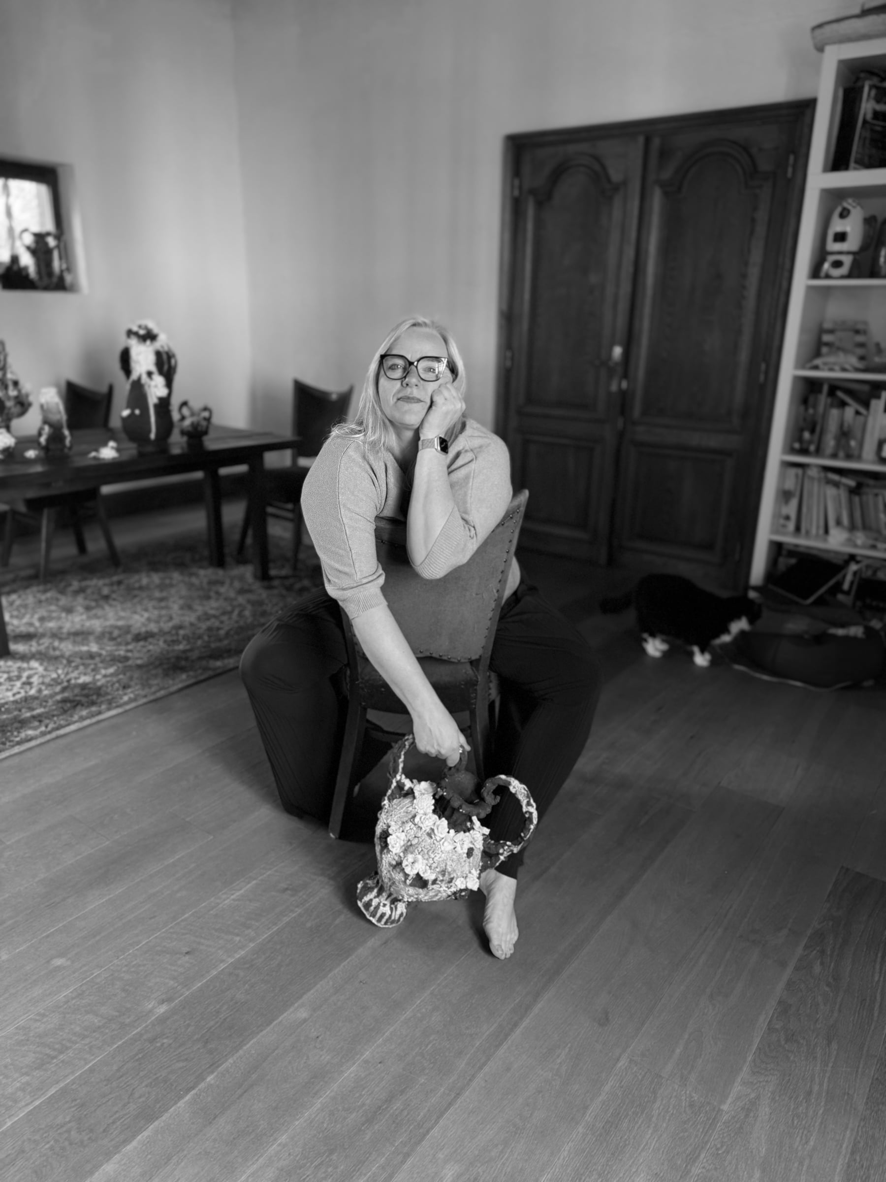 Renate Frotscher at home, with a ceramic trophy piece